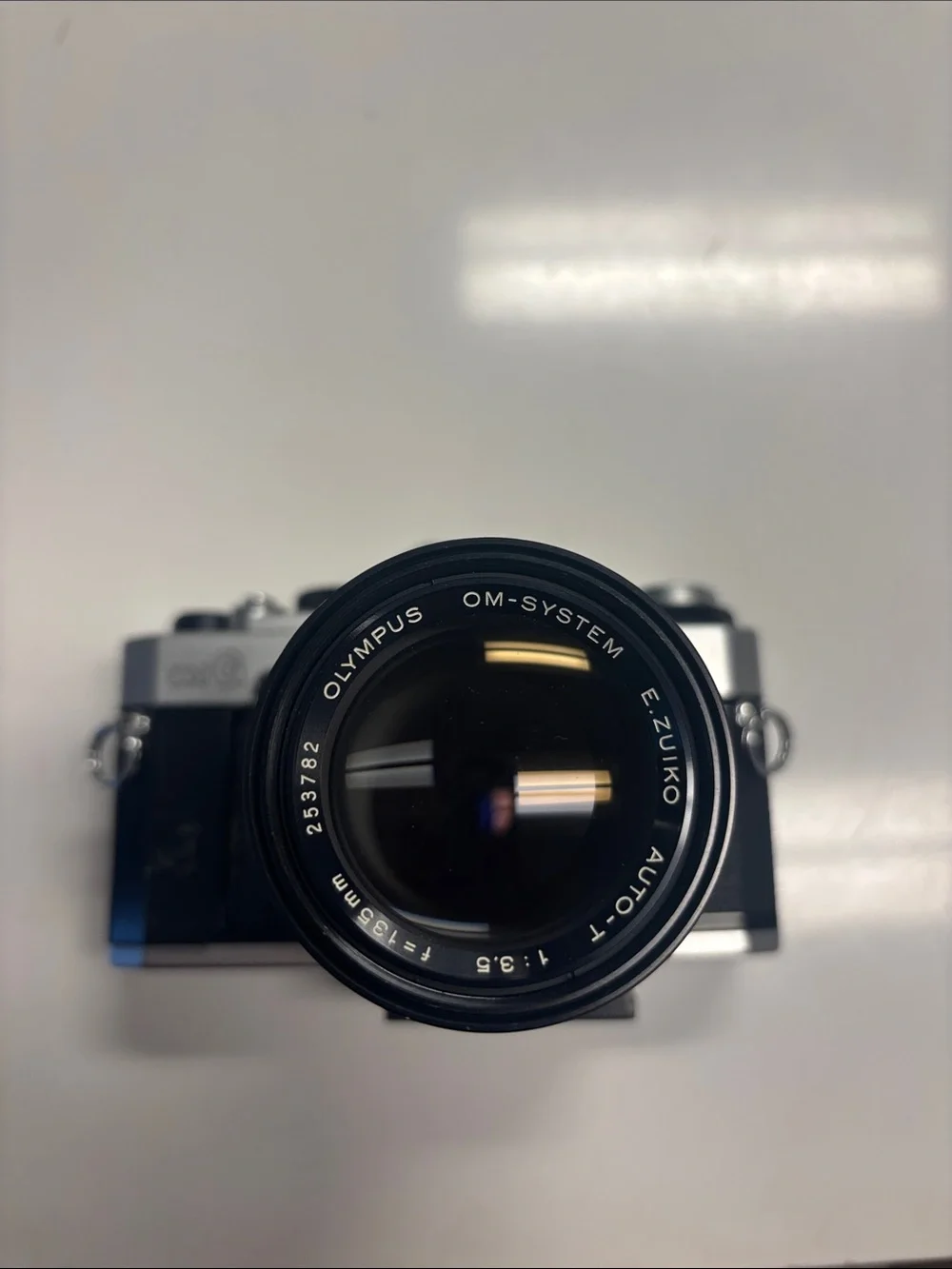 Olympus OM-G Film Camera + 135 mm lens.